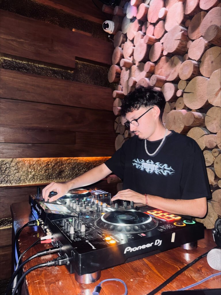 Niko mixing at a night set with friends